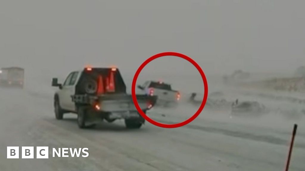 Watch: Car nearly hits first responders in Midwest blizzard conditions